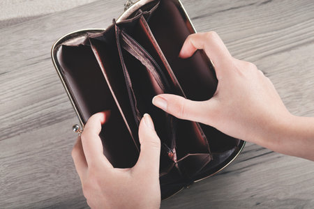 woman hand money with wallet on the desk