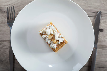 cake on the plate on the wooden table