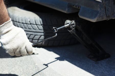 the worker man remove the car tireの写真素材