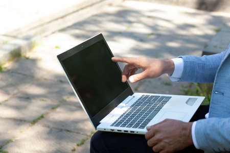 man  working in computer in  streetの写真素材