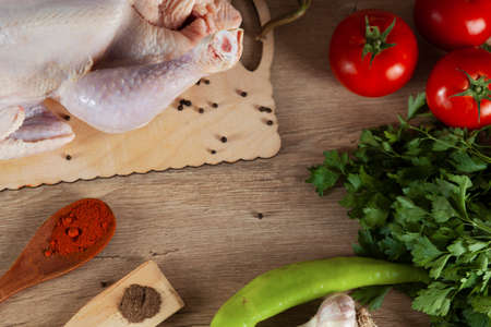 raw chicken vegetables and spicesの写真素材