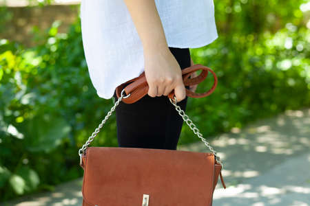 woman hand bag in streetの写真素材