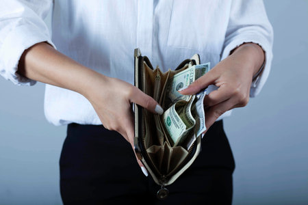 young woman hand money with wallet