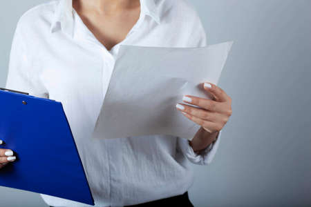 woman hand files on gray backgroundの写真素材