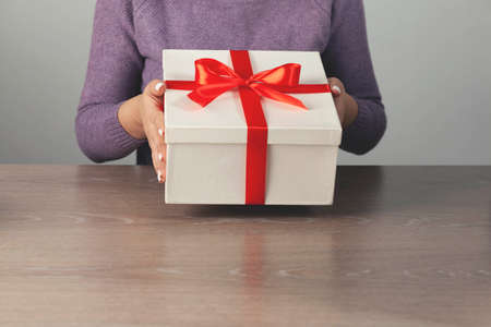 happy young woman hand open white boxの写真素材