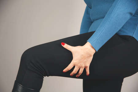skin leg of obese women on pink backgroundの写真素材