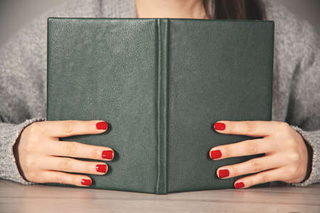 woman hand notepad on the working deskの写真素材