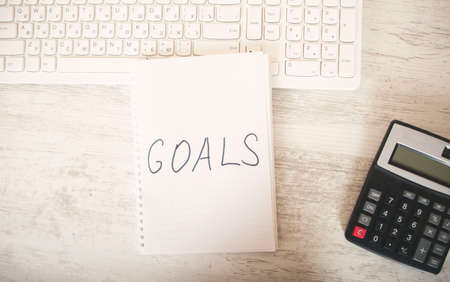 goals text on notepad with keyboard on tableの写真素材