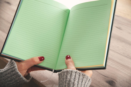 woman hand notepad on the working desk