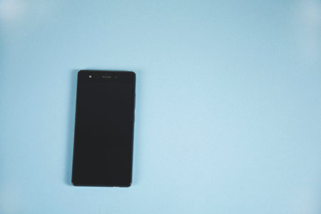 white smart phone on the color table background