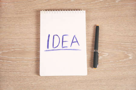 idea text on notepad with keyboard on tableの写真素材