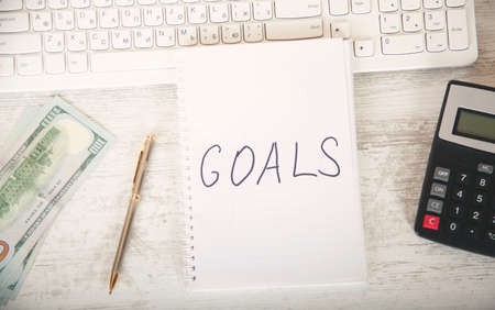 goals text on notepad with keyboard on tableの写真素材