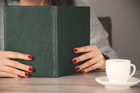 woman hand pen with notepad on the working desk