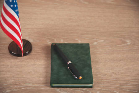 notepad and pen on the tableの写真素材