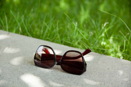 Stylish eyeglasses on wooden tableの写真素材