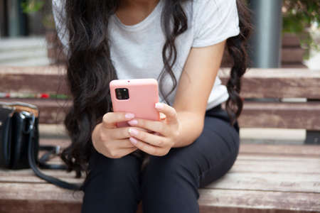 woman hand phone on the stairsの写真素材