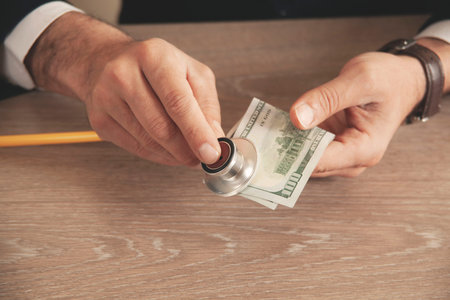 Piggy bank with stethoscope, tax offset concept
