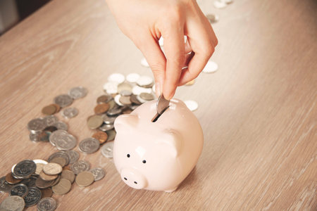 Man putting coin in piggy bank. saving money, finance concept