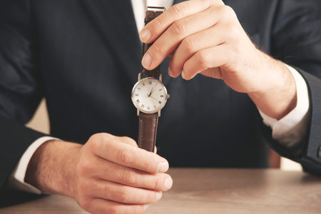 young business man hand watch in office