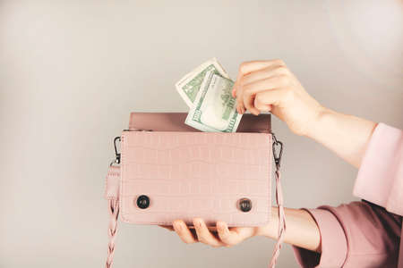 woman hand money with bagの写真素材