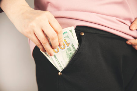 woman hand holding money in the pocket