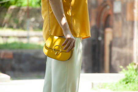 woman hand bag in the parkの写真素材