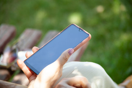 woman hand smart phone in the street
