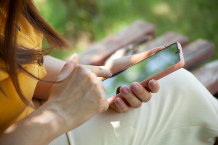 woman hand smart phone in the street