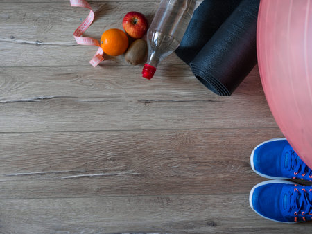 Fitness accessories. Sports shoes. Women items for sports life. Measuring tape, centimeter. The...