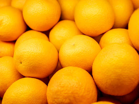 Closeup of oranges on a market. Background.の写真素材