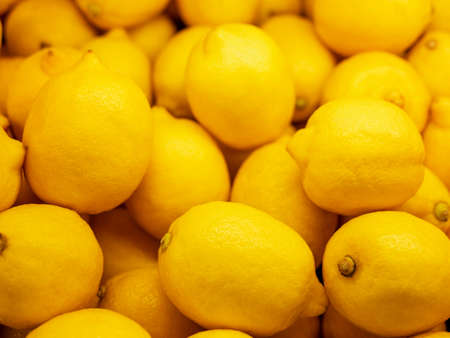 Closeup Colorful Display Of Lemons In Market. Background.の写真素材