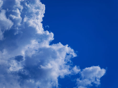 Blue sky with white clouds closeup. Summer Rest and Happy Life Concept.