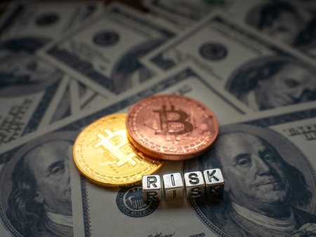 Bitcoins, New Virtual money concept.Gold bitcoins with name Risk and dollars' background. Golden coins with icon letter B. Mining or blockchain technology.の写真素材