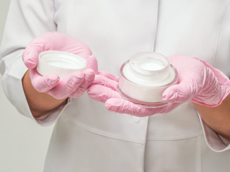 Doctor opening a jar of cream. Doctor Cosmetologist works in a clinic. Cosmetic means and skin...