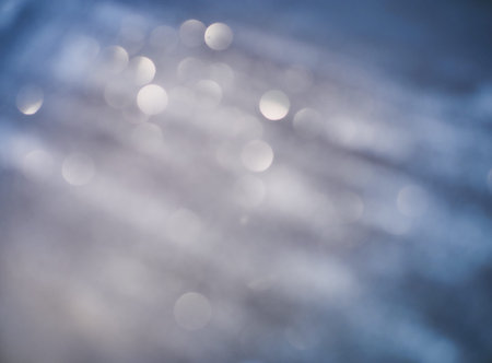 New Year Christmas Blurred background. Abstract defocused gold, white, red and yellow glitters...