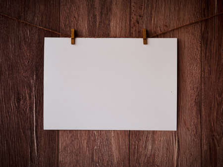 Blank for text on a wooden background. Letter on the clothespins. Vintage wooden texture. Free space. Copy Space.の写真素材
