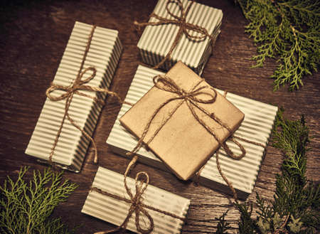 Creative layout made of Christmas tree branches with gifts. Flat lay. Nature New Year conceptの写真素材