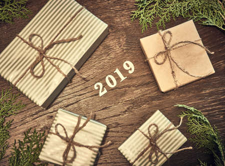 Creative layout made of Christmas tree branches with gifts. Flat lay. Nature New Year conceptの写真素材
