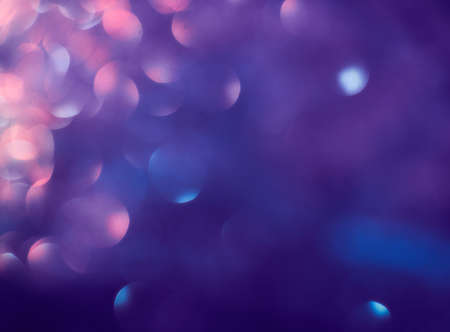 Purple glitter lights background. defocused soft light. lens flare. abstract shine. colorful backgroundの写真素材