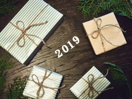 Christmas composition. 2019 Christmas gifts, pine branches, toys