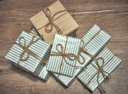 New year gift decoration on dark wooden board. New Year and Christmas background. Holiday concept