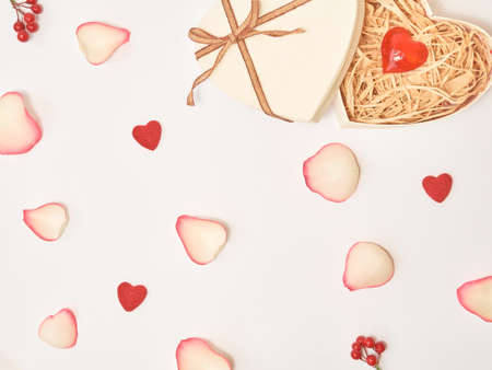 Gift and roses composition on the white background. Top view, flat lay. Birthday, Mother's, Valentines, Women's, Wedding Day concept.の写真素材