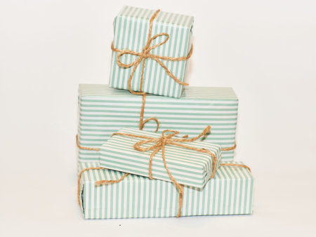 Gift Boxes tired with bow on white background. Layout for delivery, Christmas, Valentine's Day,...