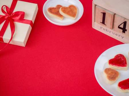 Valentines Day concept. Self made pastry hearts cakes with calendar and gift. Holiday concept....
