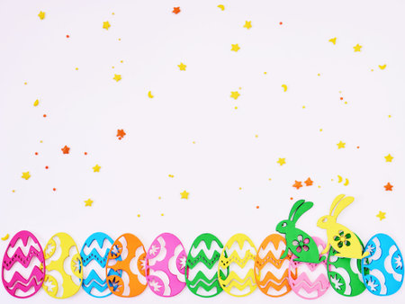Colored eggs composition flat lay on white background, close up.