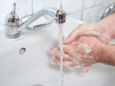 Man Wash hands with soap. Coronavirus protect. COVID-29 prevention.