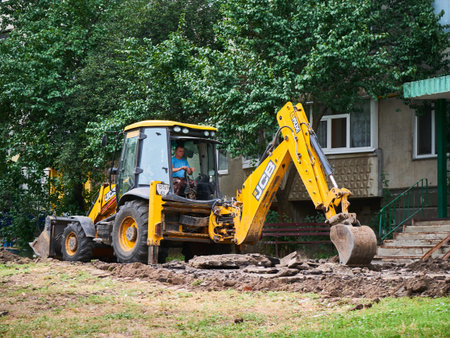 Buldozer Making and constructing a new asphalt road near the civil building. Concepts of improvement of the territory of buildings.のeditorial素材