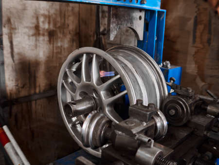 Refurbishment, renewaling and repairing of the alloy aluminium automobile damaged disk at tire service box.の写真素材
