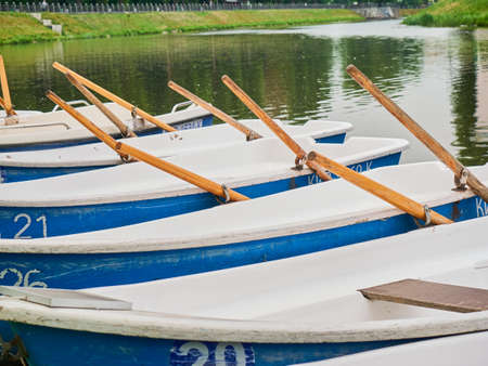 Boats in the row at the river. Boats for rent. Travel river boats.の写真素材