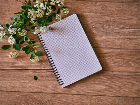 Top view of open blank notebook, bouquet, flower. Travel and adventure concept, journey diary.の写真素材